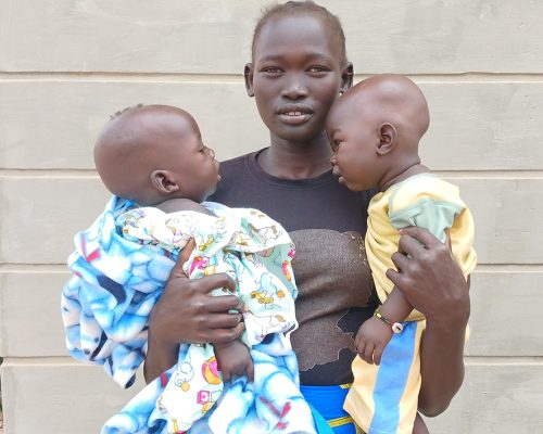 Photo 2_ A mother with her babies following an assessment at the PHCC
