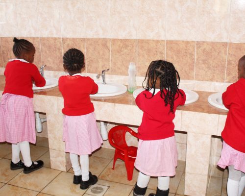 washing hands inside the ablution block